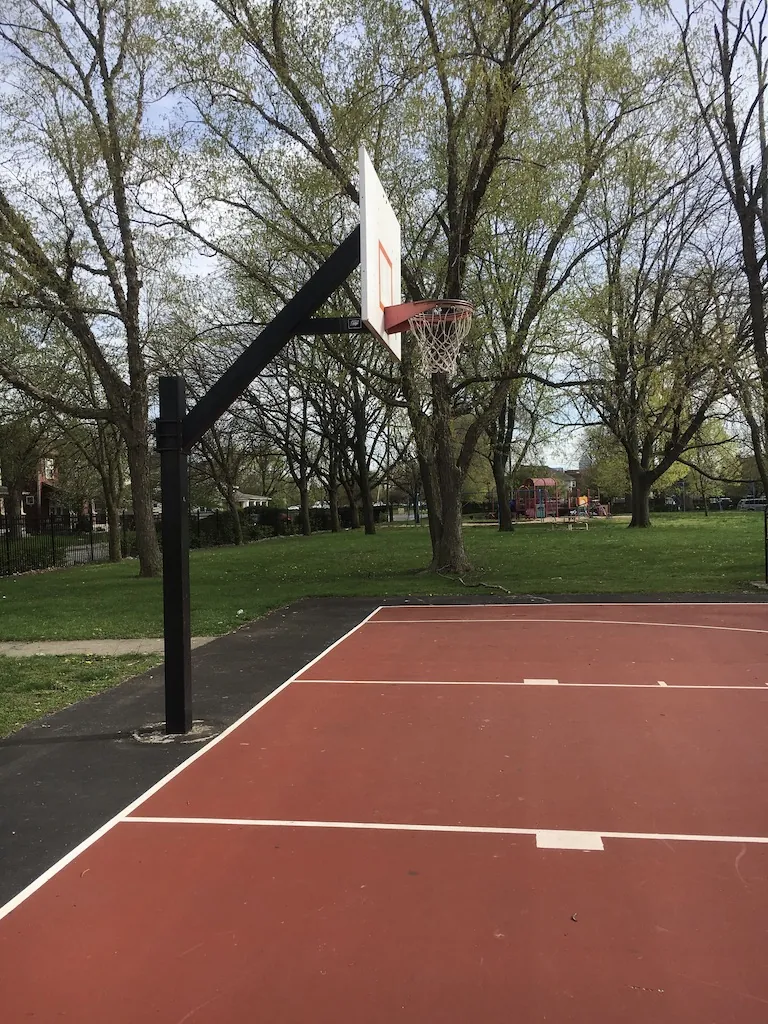 Basketball hoop on the outdoor court at Olin Park, Indianapolis